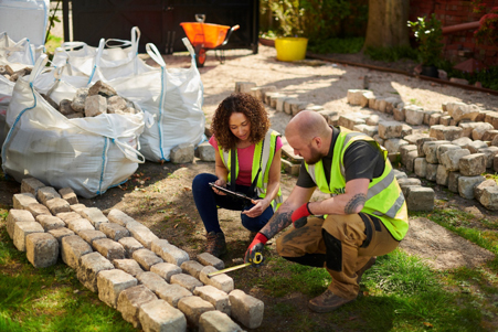 apprentice in landscape construction working with superior